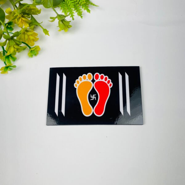 Sacred Charan Paduka MDF wall decor with auspicious footprints and swastik symbol on black background